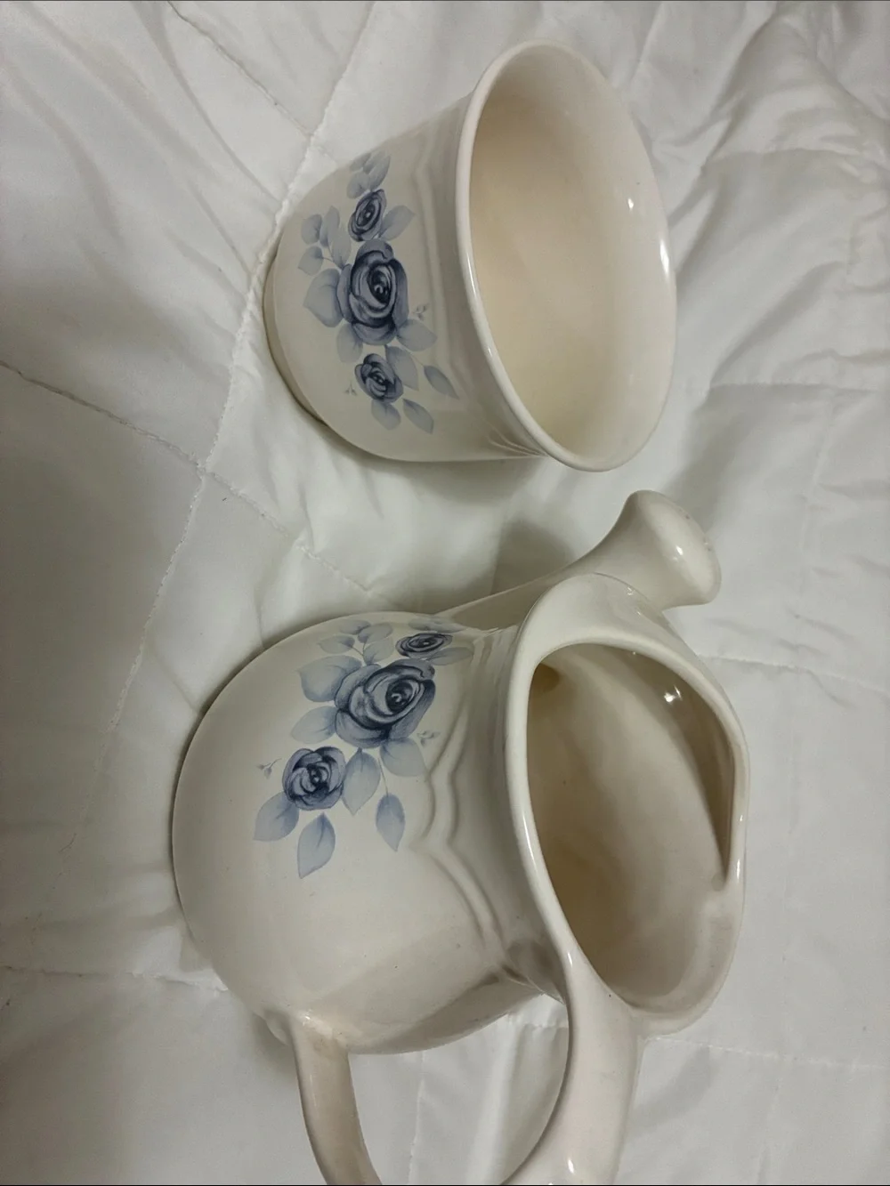 Pfaltzgraff  blue floral vase and watering pitcher.
